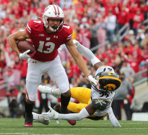 Wisconsin wide receiver Chimere Dike breaks a tackle against Iowa.